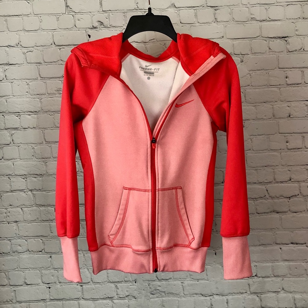 Nike bright coral and pink colored zip up “thermafit” hoodie. Size XS